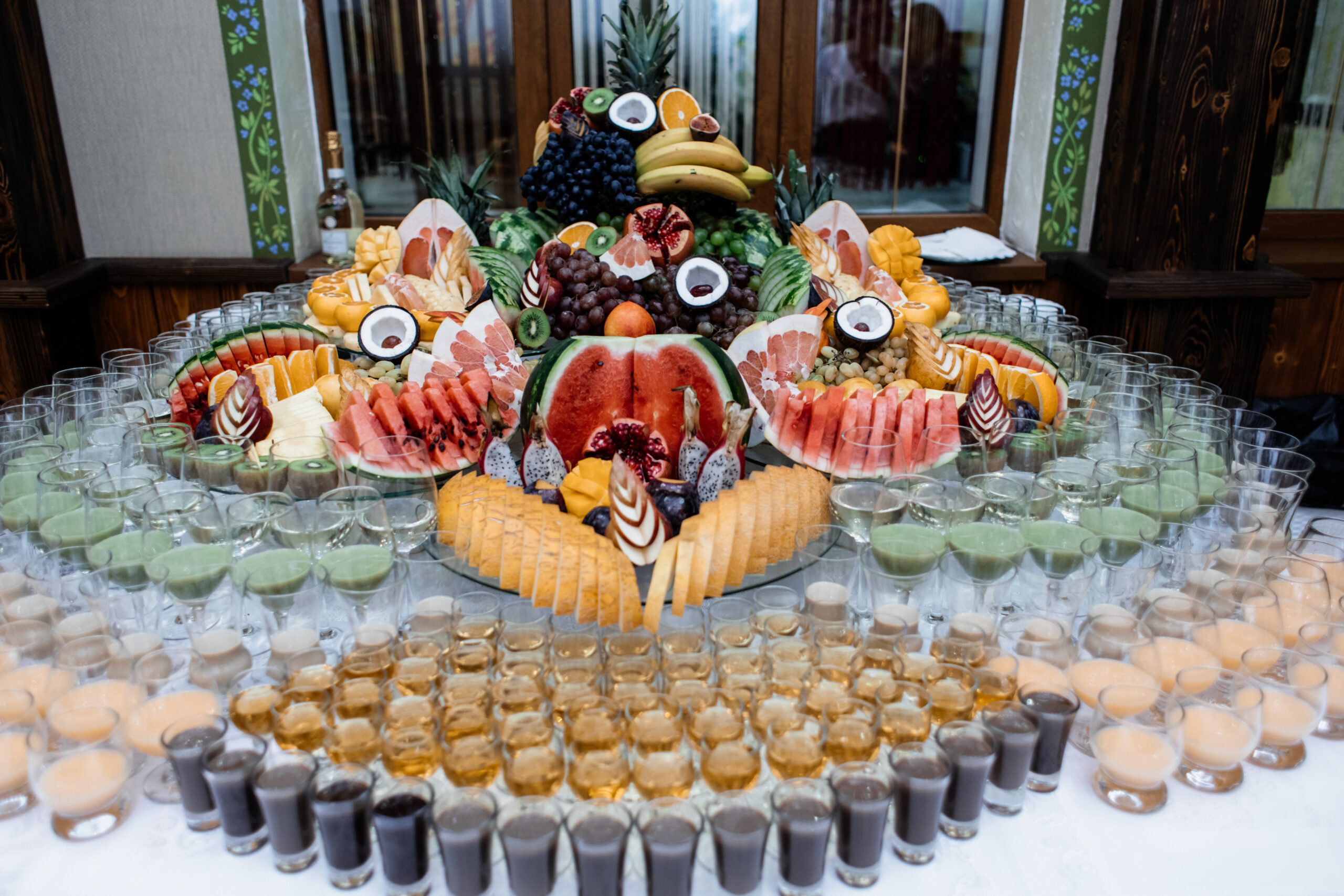 Lot of variety of fruits and drinks served on a celebration tabl