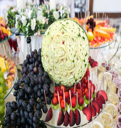Cocktail with fruits, grapefruit, grapes, apple, pomegranate, wa